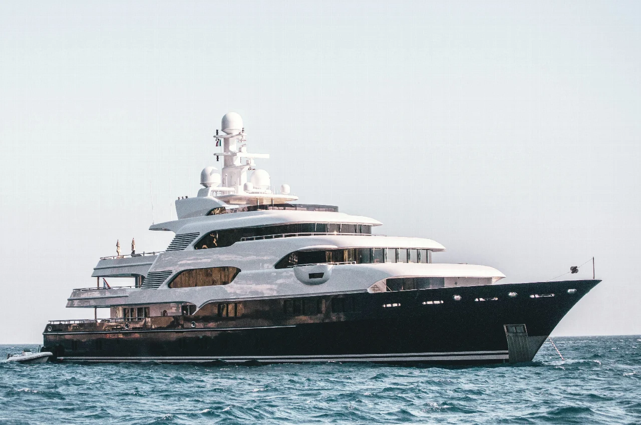 Full side profile of a motor yacht on open water