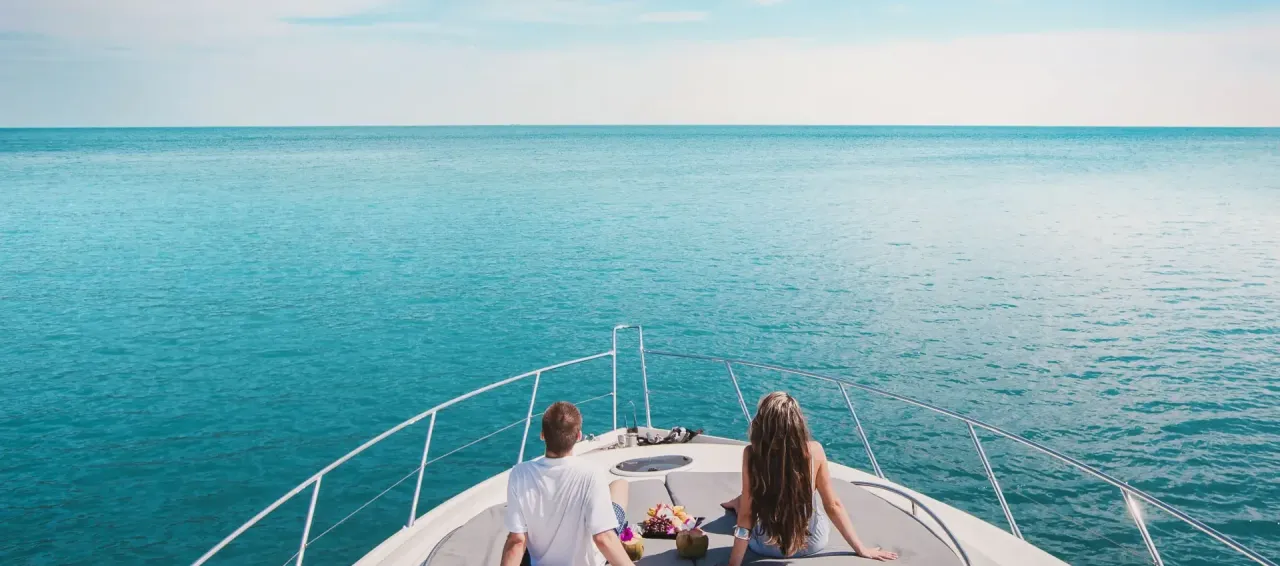 Elite Pearl Charter yacht cruising past Bluewaters Island