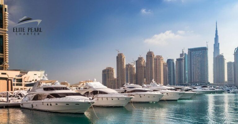 boats berthed on a dock with burj khalifa in the view with elite pearl charter
