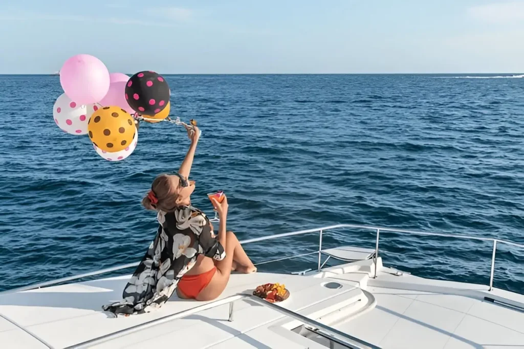 elite pearl charter - people celebrate on a yacht boat.