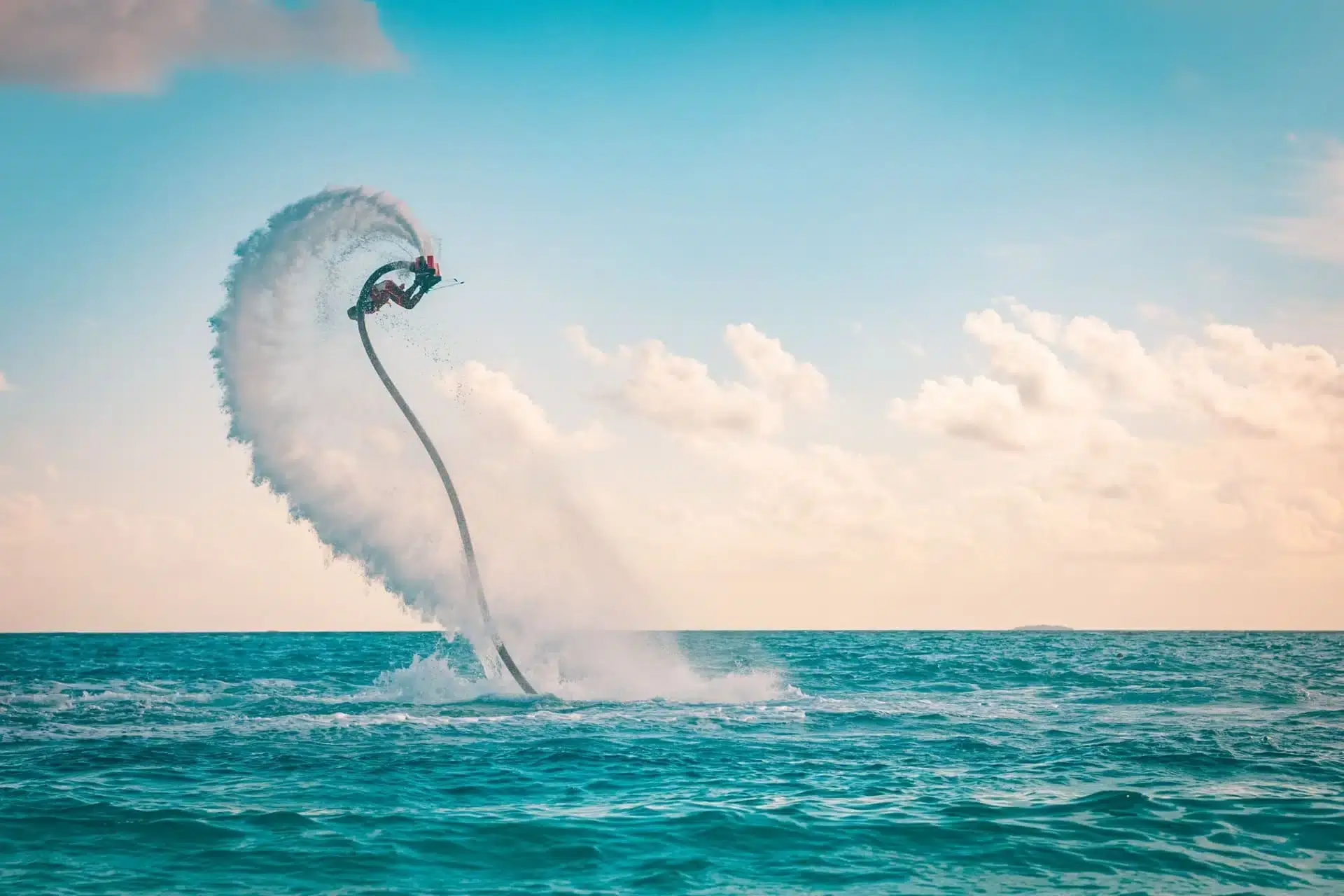 elite pearl charter - a person doing stunts on a water flyboard.