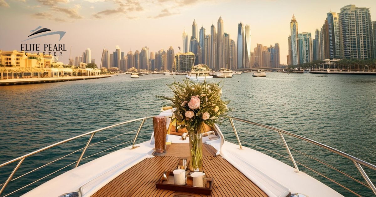 a flower and cups in front of a yacht during dusk with elite pearl charter. Celebrate your anniversary on yacht in Dubai image blog.
